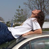 Roy, doing a silly GQ-esque pose on Raes car. (rest area in missouri)